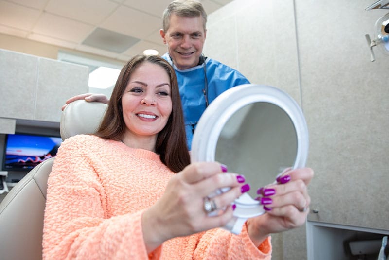 patient smiling brightly after their dental treatment